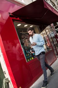 Young man standing in traditional clothing