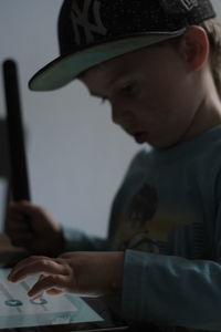 Close-up of boy using mobile phone