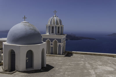 Santorini, greece, may 3, 2024. belfry and sea view, orthodox church of st. mark the evangelist, 