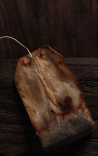 Close-up of dry leaf on wooden table