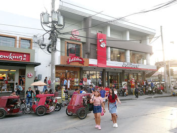 People walking on street in city