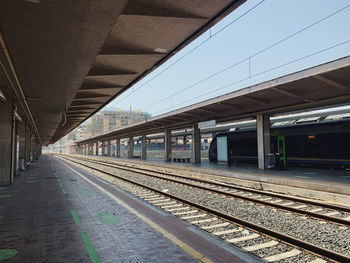 Railroad station platform against clear sky