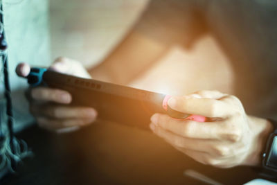 Close-up of man using mobile phone