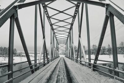 Low angle view of snow covered bridge