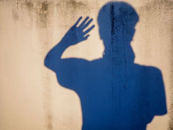 Shadow of man on wall