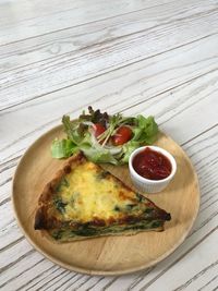 High angle view of pizza in plate on table