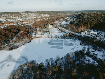 High angle view of snow covered plants against sky