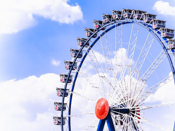 Low angle view of ferris wheel against sky