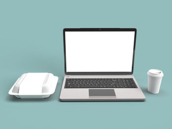 Electric lamp on table against white background