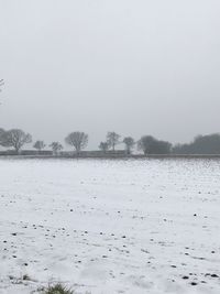 Scenic view of frozen lake against sky during winter