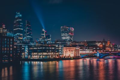 Illuminated buildings in city at night