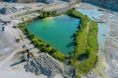 High angle view of people by swimming pool in lake