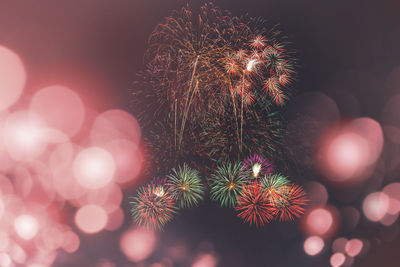 Close-up of illuminated fireworks against sky at night