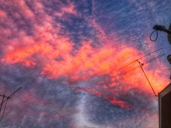 Low angle view of dramatic sky during sunset