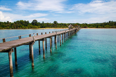 Pier over sea against sky