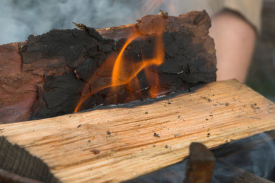 Close-up of fire on log