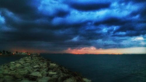 Scenic view of sea against dramatic sky