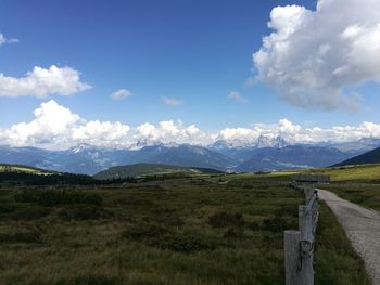 Scenic view of mountains against cloudy sky