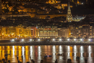 Illuminated buildings in city at night