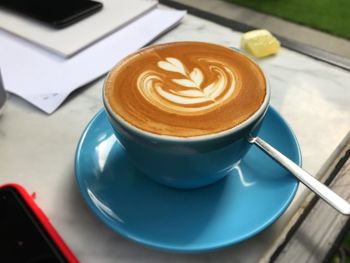 High angle view of cappuccino on table