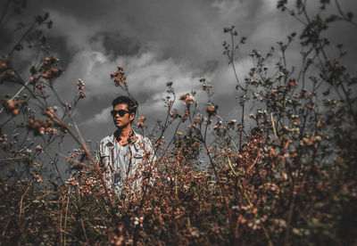 Young man standing on field