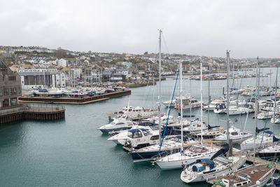 Landscape photo of boats floating in the harbor in falmouth