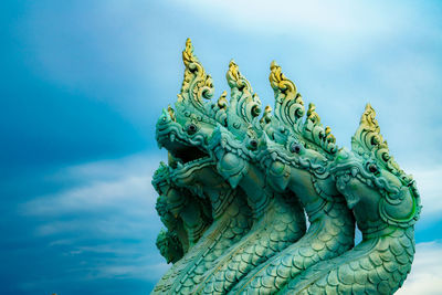 Low angle view of statue against sky