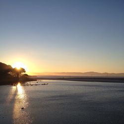Scenic view of sunset over river