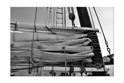 Low angle view of sailboats moored at harbor