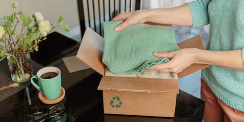 Midsection of woman holding gift box