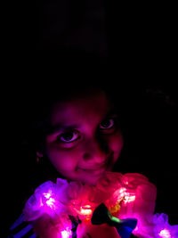 Portrait of cute girl in darkroom