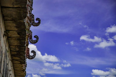 Low angle view of basketball hoop against blue sky
