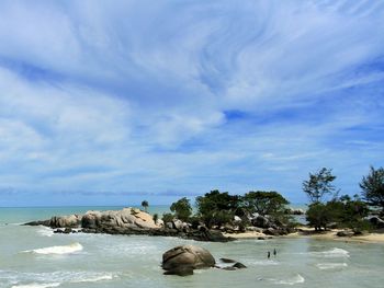 Scenic view of sea against cloudy sky