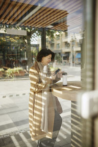 Businesswoman using cell phone