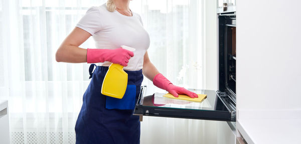 Rear view of woman standing in office