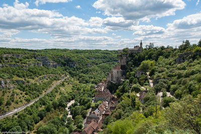 Panoramic shot of green landscape against sky