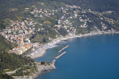Aerial view of city by sea
