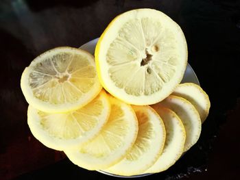 Close-up of lemon slice against black background