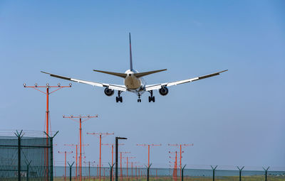 Low angle view of airplane flying in sky