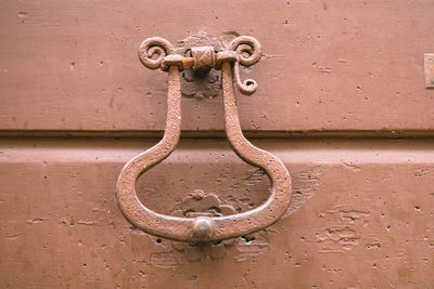 Close-up of chain hanging on metal door