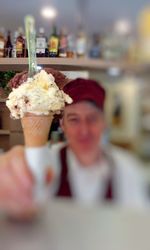 Close-up of woman holding ice cream