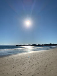 Scenic view of beach against clear sky