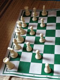 High angle view of chess pieces on table