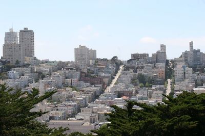 High angle view of buildings in city against sky