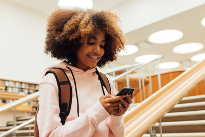 Young woman using mobile phone