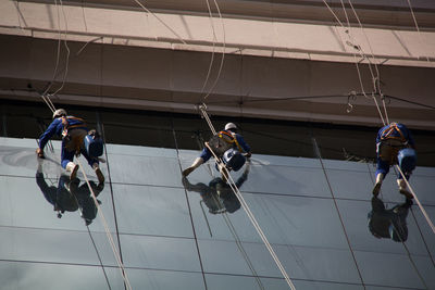 People working on rope in city