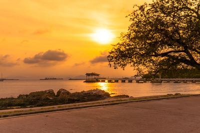 Scenic view of sea against orange sky