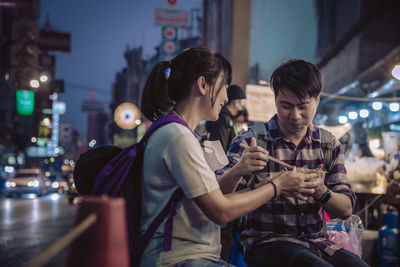 People sitting in city