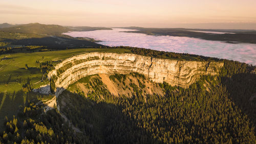 High angle view of land against sky during sunset