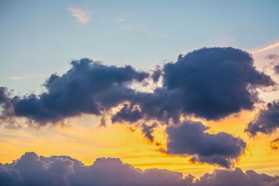 Low angle view of dramatic sky during sunset